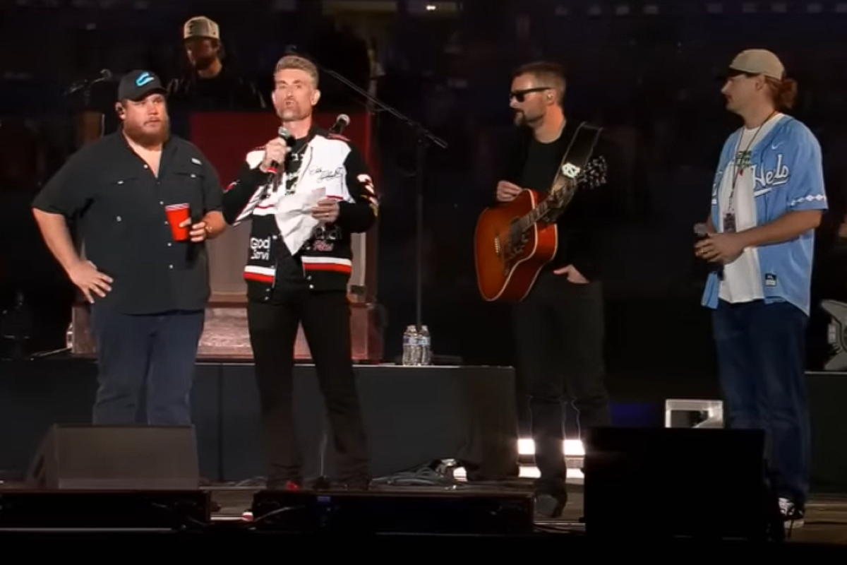 luke combs and eric church on stage
