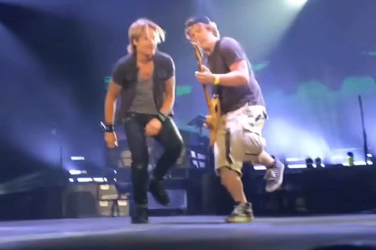 keith urban and rob royce performing on stage