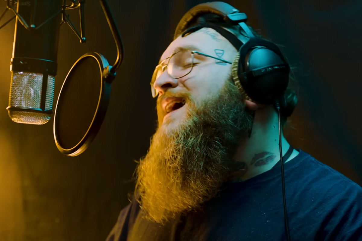 teddy swims singing into microphone