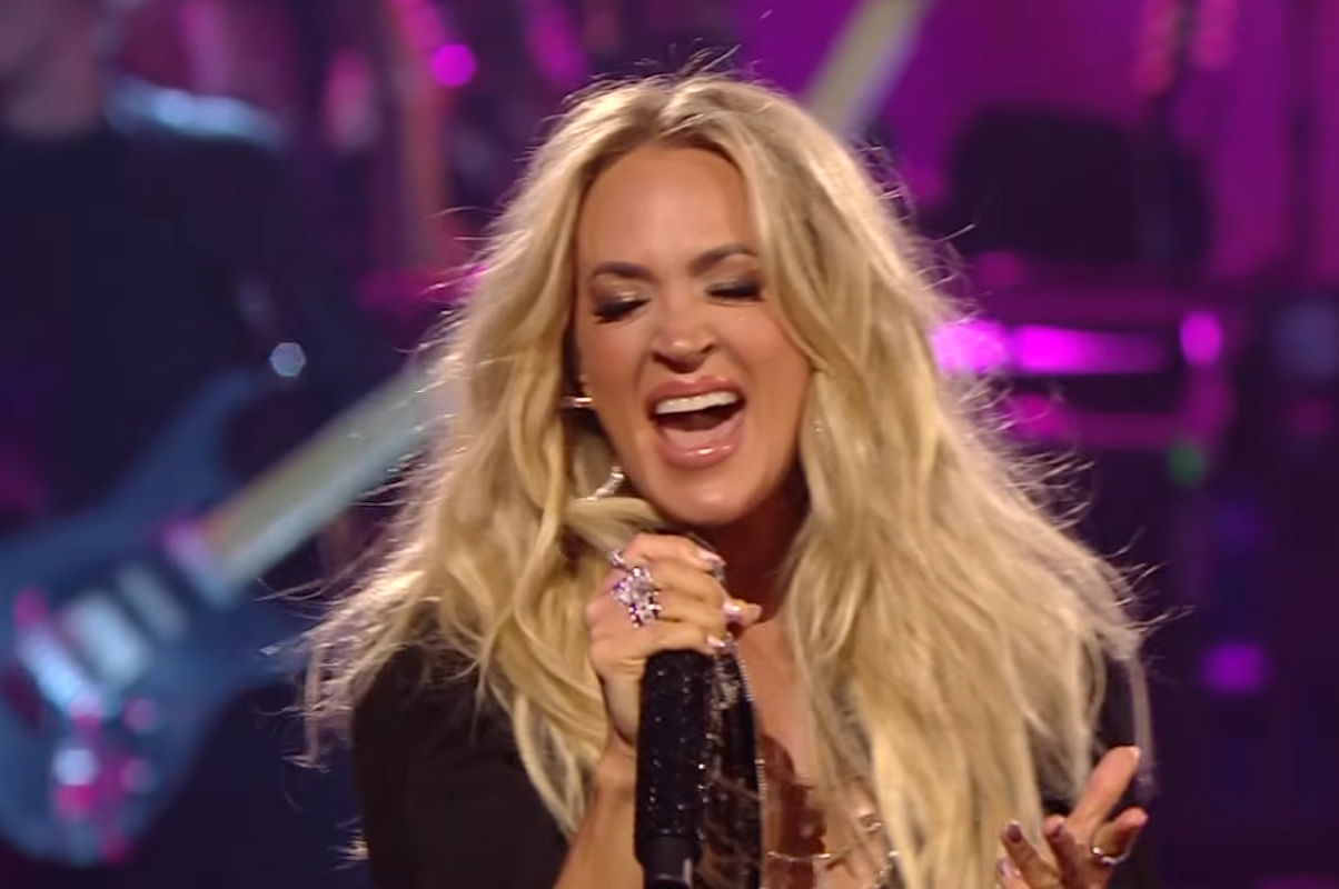 Carrie Underwood singing into microphone