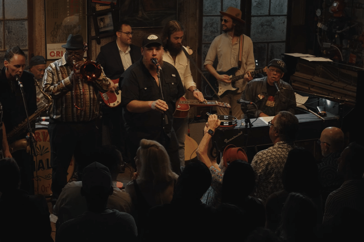 Luke Combs singing on stage