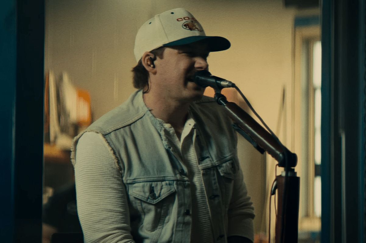 Morgan Wallen singing in an automotive shop