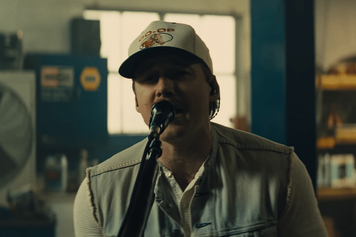 Morgan Wallen singing into a microphone