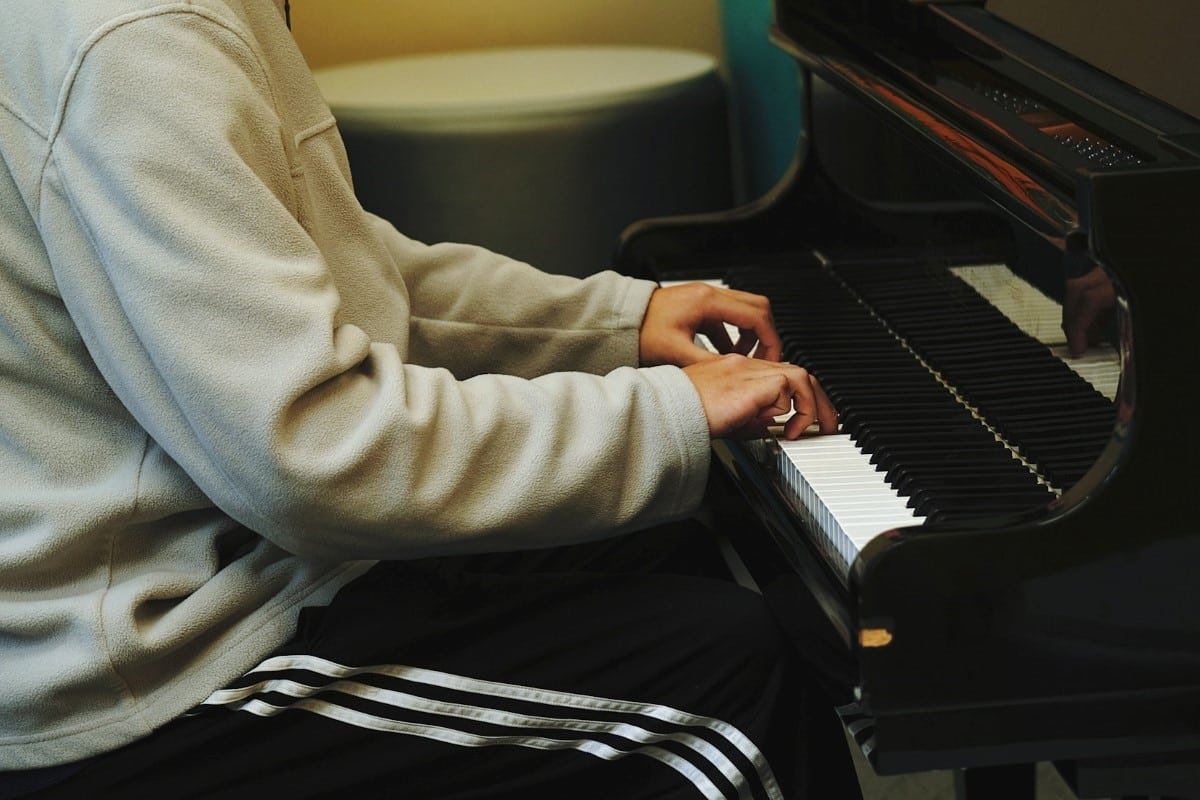 A person taking an online piano course