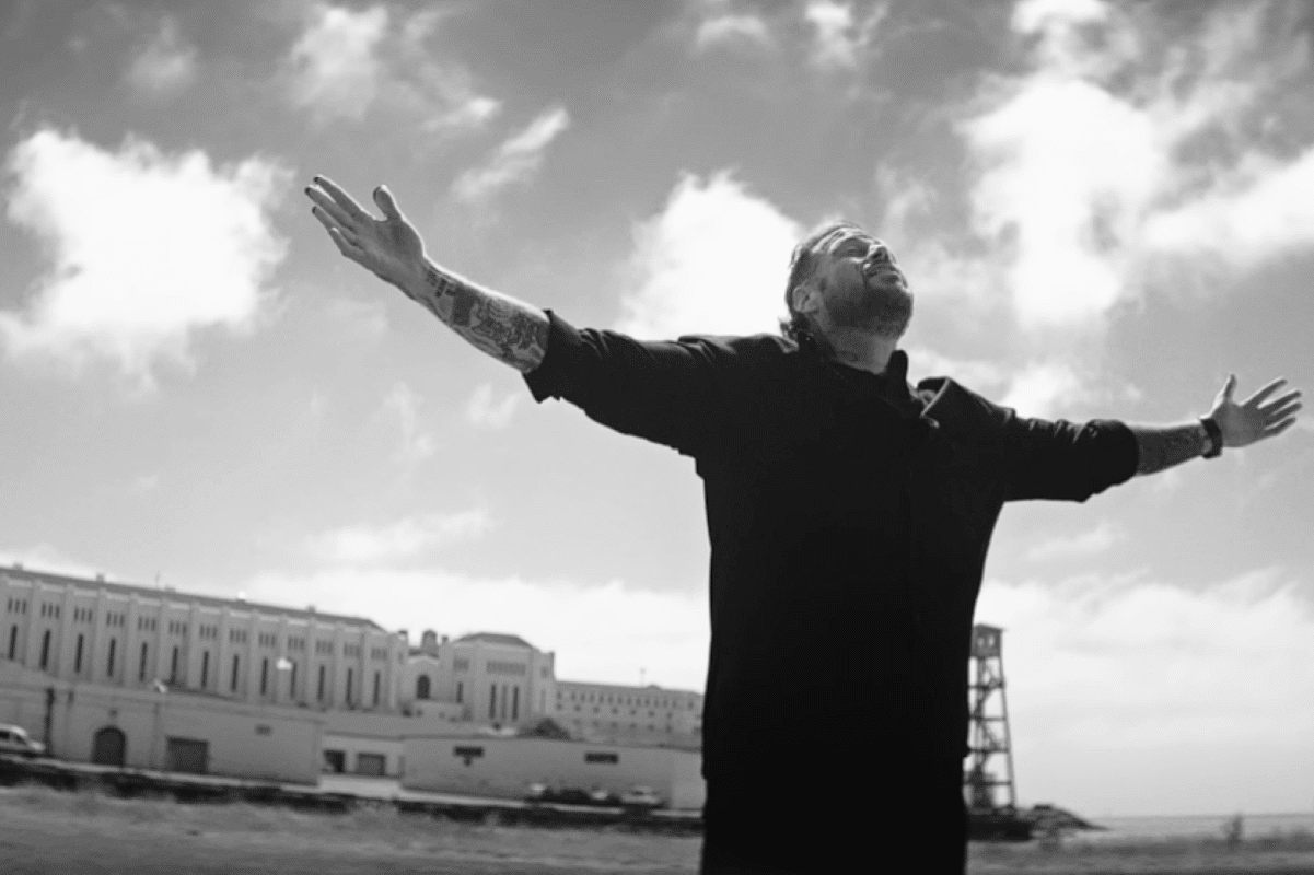 Jelly Roll with his hands up outside of San Quentin